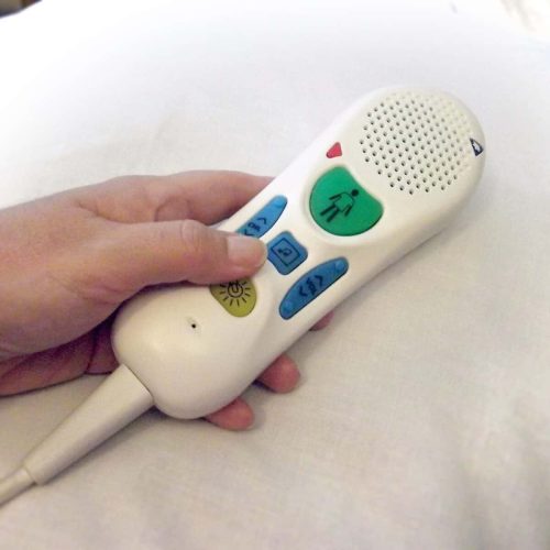 Hospital bed nurse call button